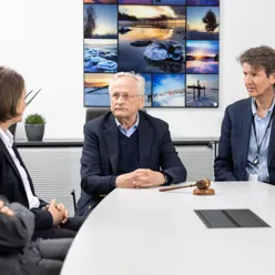 A group of people sitting around a table