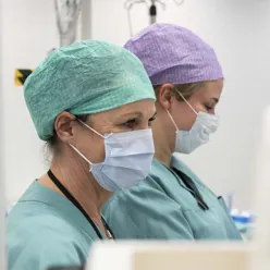 A couple of surgeons in a room